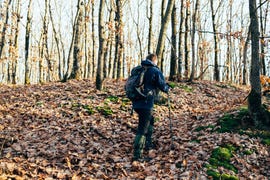 hiker exploring a mountain alone during beautiful day