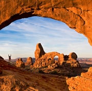 Hiker in North Window Arch hiker in north window arch
