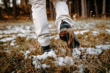 hiker walks on mountain trail