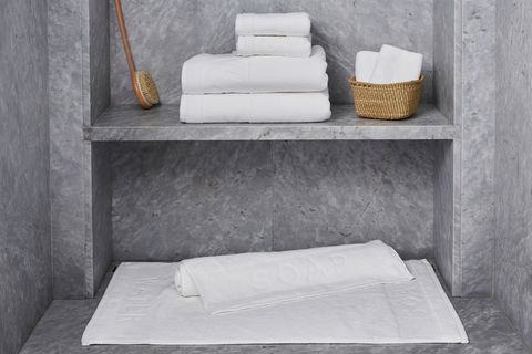 Shelf, Bathroom accessory, Wall, Towel, Furniture, Marble, Table, Room, Concrete, Linens, 
