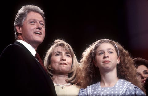 bill, hillary, and chelsea clinton standing together