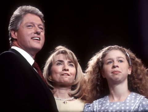 bill, hillary, and chelsea clinton standing together