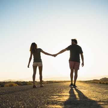 couple walking on remote road