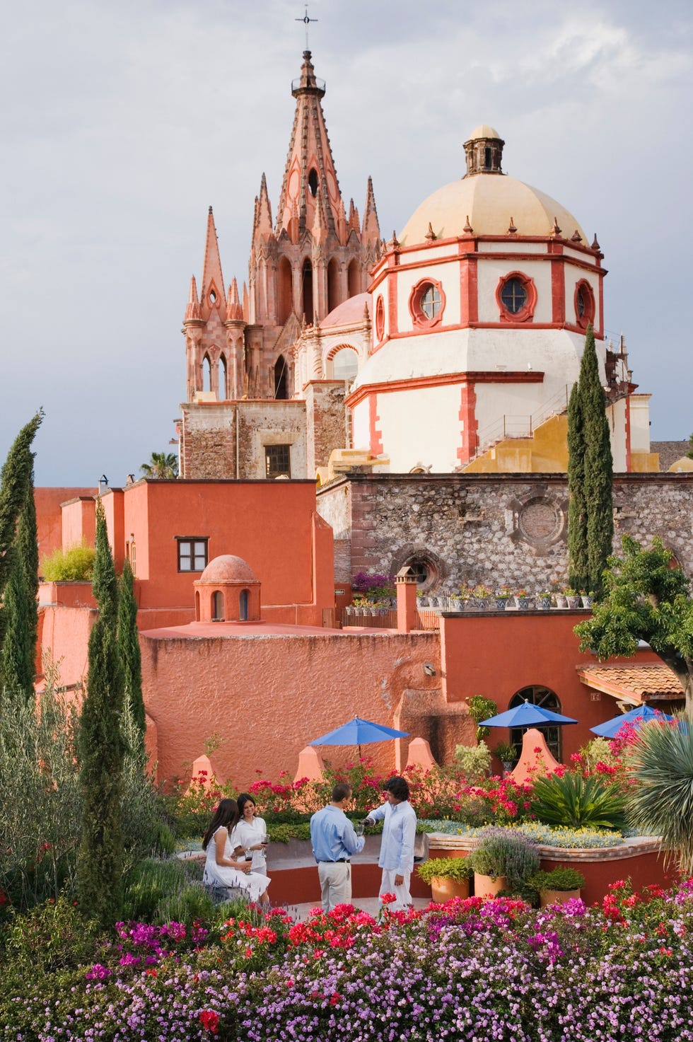 hispanic couples with cathedral in background