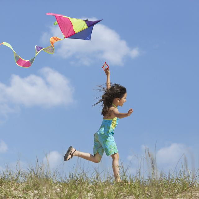how to fly a kite, girl with kite in field