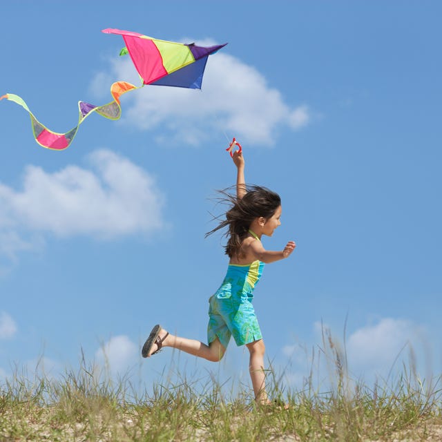 how to fly a kite, girl with kite in field