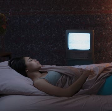 Hispanic woman sleeping with television on Hispanic woman sleeping with television on