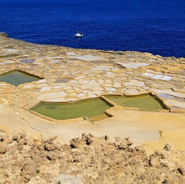 historic ancient salt pans on coast near marsalforn, island of gozo, malta
