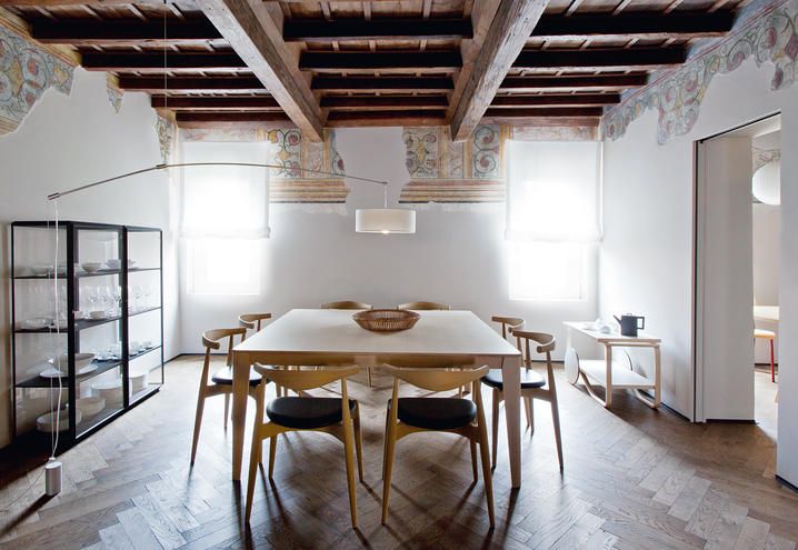 FOR THE DINING AREA, THE 45° DISPLAY CASES, DESIGNED BY RON GILAD FOR MOLTENI&C, MADE TO MEASURE TABLE BY ANGELO MANGIAROTTI FOR AGAPE CASA, WITH CH20 CHAIRS BY HANS J. WEGNER. LIGHT BY DEPADOVA, TROLLEY BY ARTEK. ANTIQUE OAK FLOOR FINISHED WITH OIL.