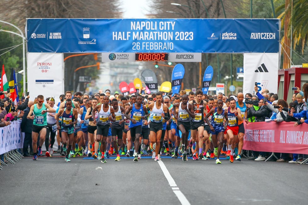 a group of people running in a race