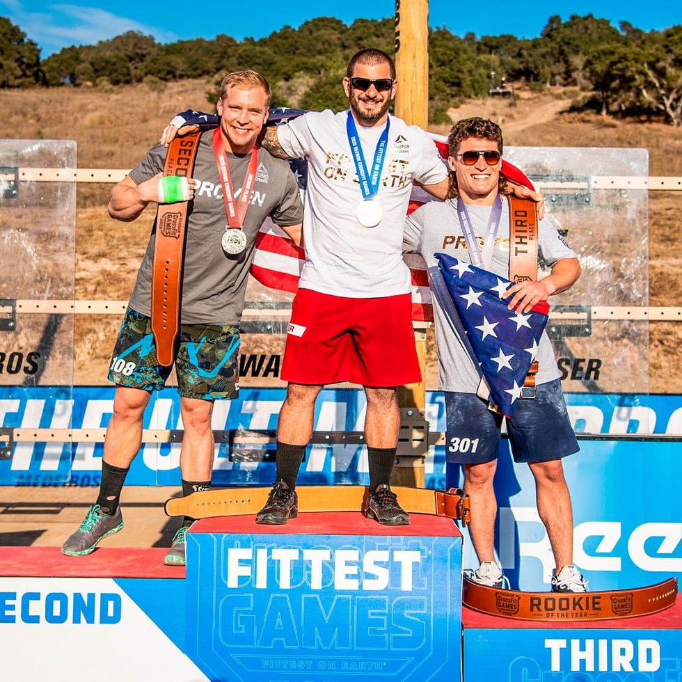 the podium at the 2020 crossfit games mathew fraser winner, samuel kwant second, and justin medeiros third