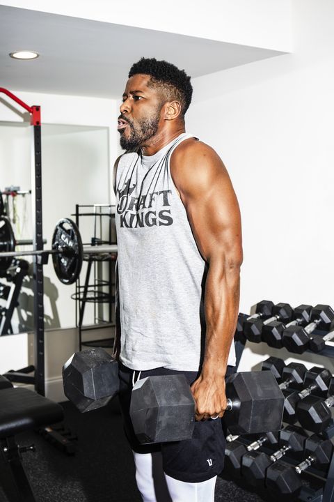 franklin lakes, nj, october 27, 2021   former nfl player and tv sports broadcaster nate burleson working out in his basement gym at home photos by lanna apisukh
