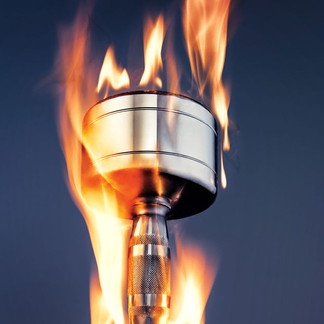 silver dumbbell with flames superimposed