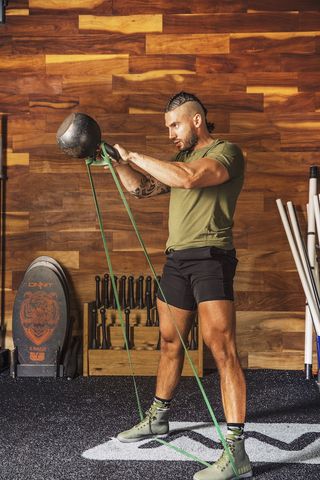 reinhard nel, a coach at onnit gym in austin, texas banded kettlebell swing