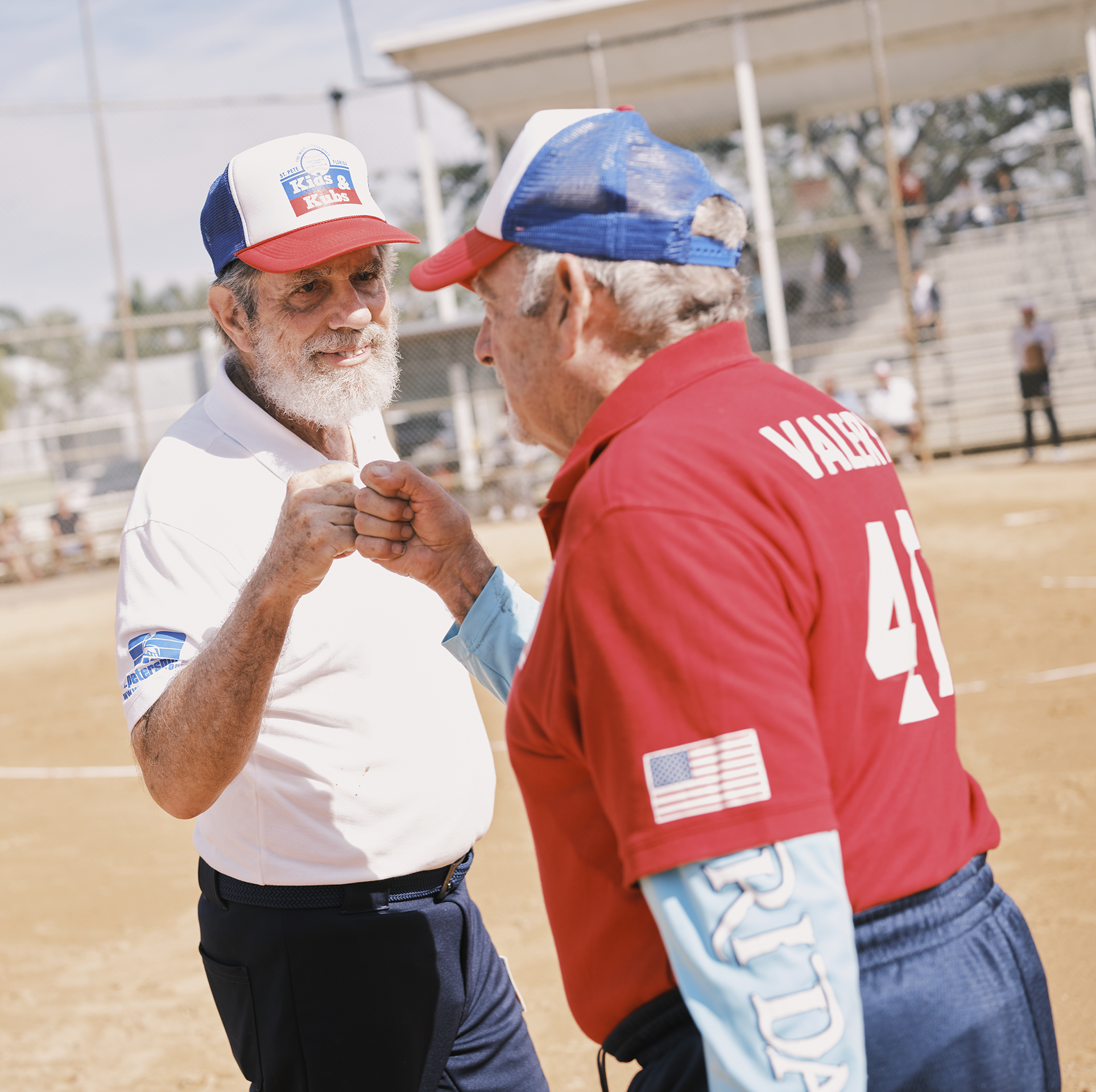 john draeger gives a fist bump to his opponent after a game in the kids ’n kubs softball league on january 24, 2023 in st petersburg, floridazack wittman for men’s health