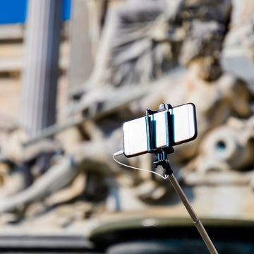 smartphone with selfie stick in vienna austria
