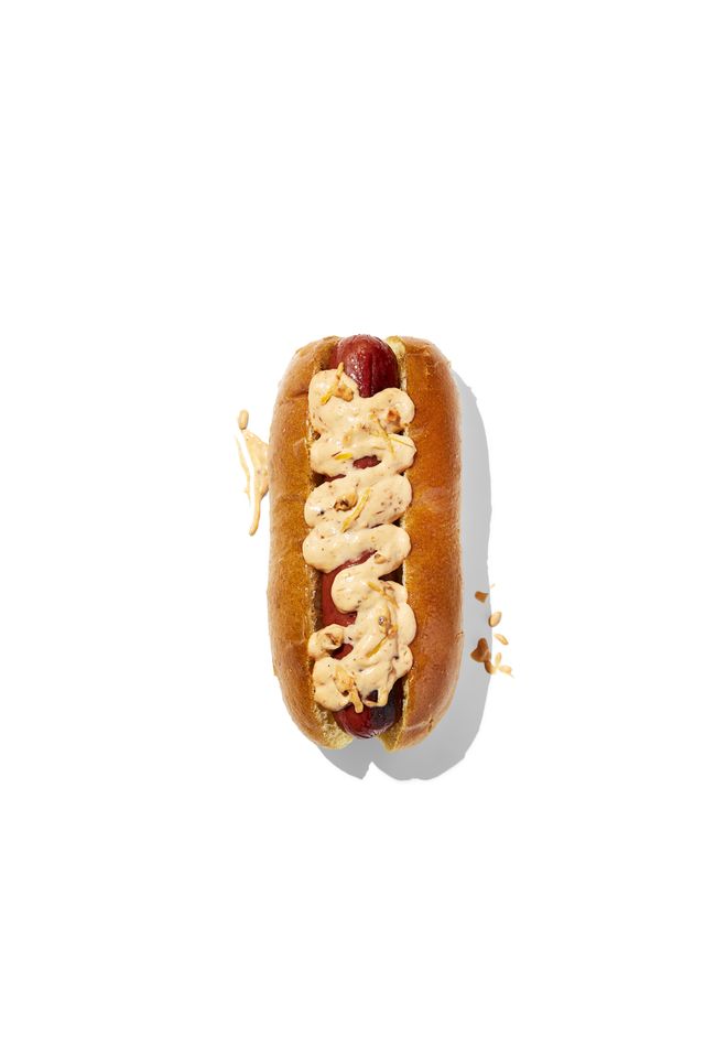 hotdog with toppings pesto aioli mayonnaise, sun dried tomato pesto, lemon zest