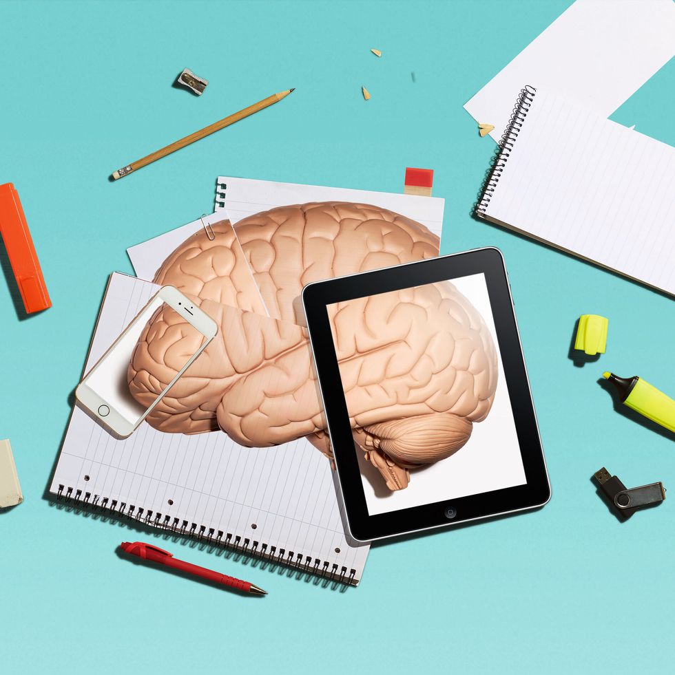 brain on top of papers and ipad