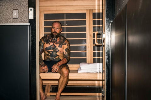 country musician zac brown working out in his truck trailer gym that goes on tour with him