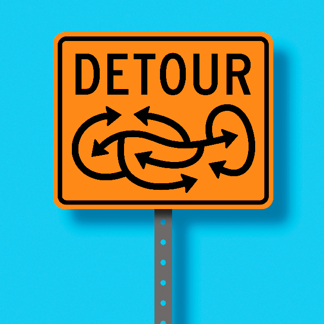sign saying detour and showing a labyrinth of arrows
