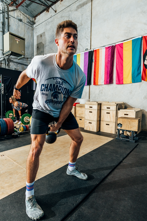 person using kettlebells