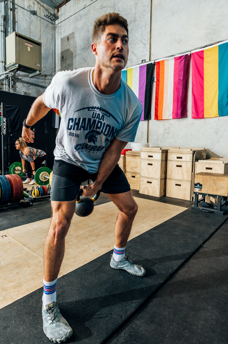 person using kettlebells