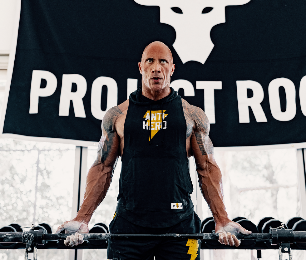 the rock lifting weights