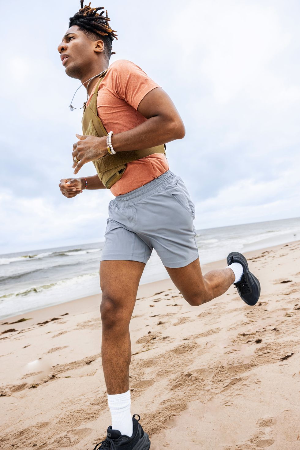 a man running on a beach