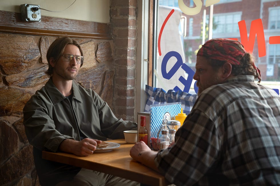 hit man l r glen powell as gary johnson and bryant carroll as walt in hit man cr brian roedelnetflix