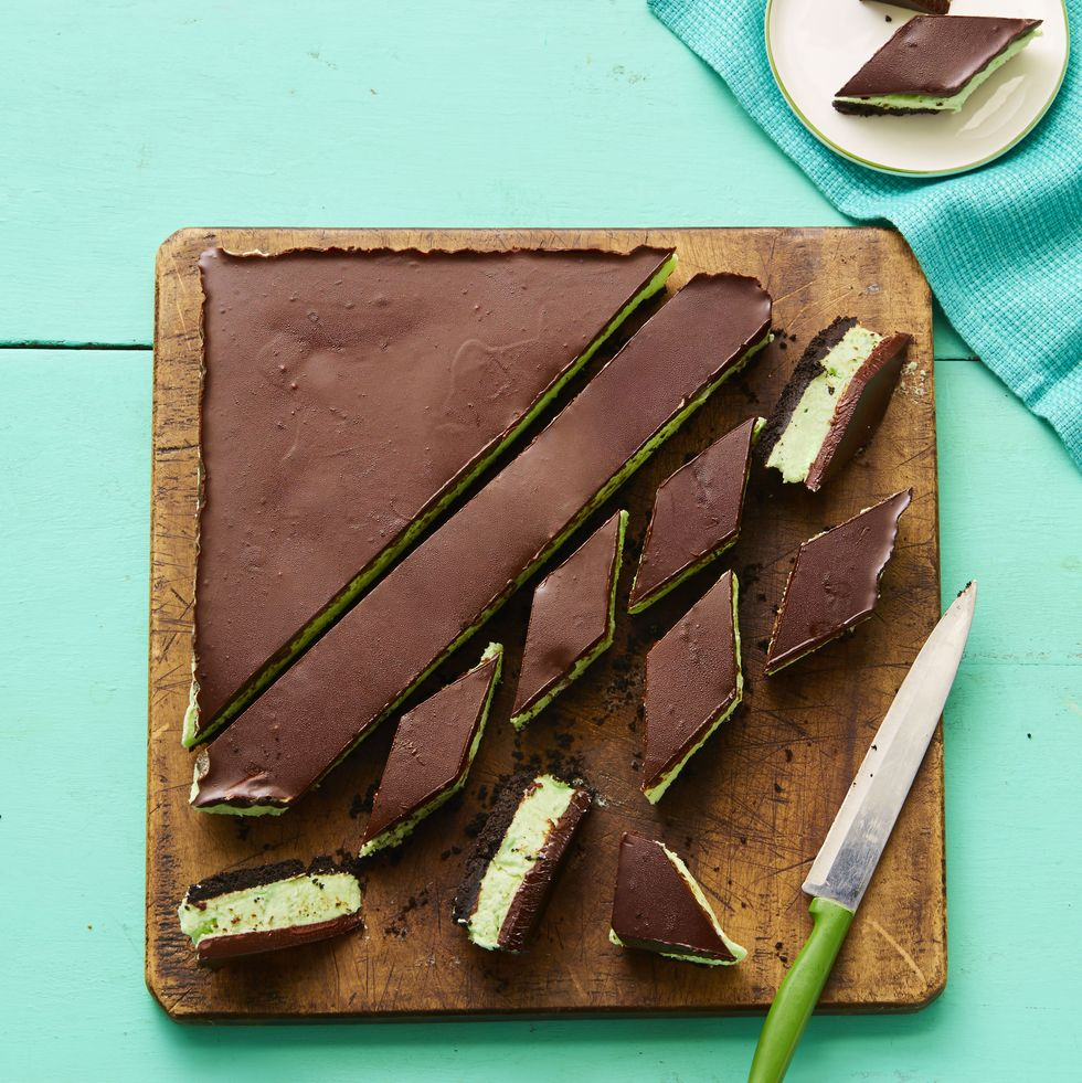 peppermint and chocolate bars on wood cutting board
