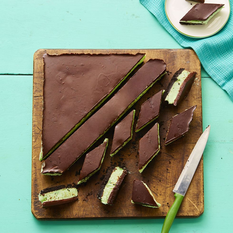 peppermint and chocolate bars on wood cutting board