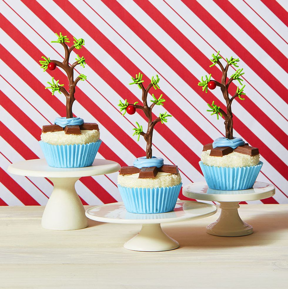 christmas tree cupcakes with red and white striped background
