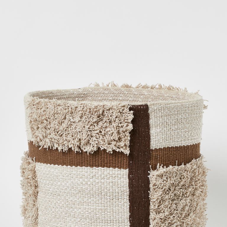 round storage basket in braided fabric made from recycled cotton with tufted sections size 37x37 cm