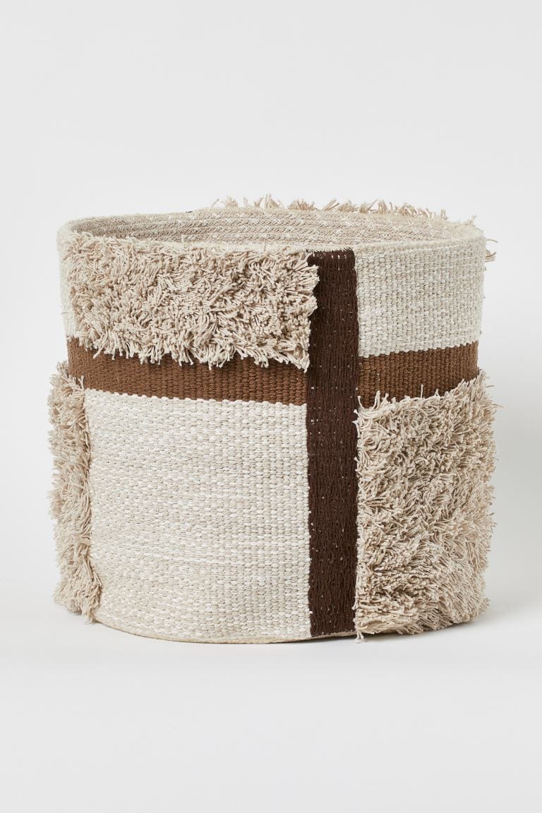 round storage basket in braided fabric made from recycled cotton with tufted sections size 37x37 cm