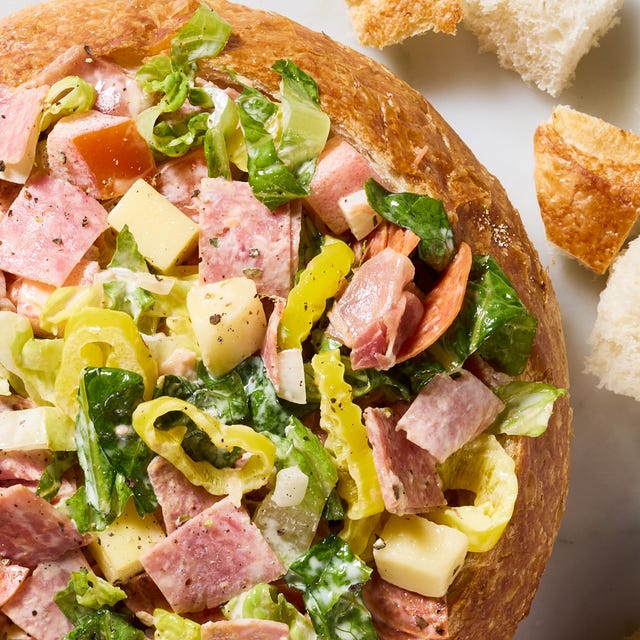 salami, pepperoni, lettuce, and pepperoncini in a bread bowl