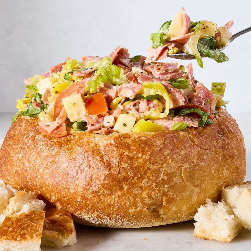 salami, pepperoni, lettuce, and pepperoncini in a bread bowl