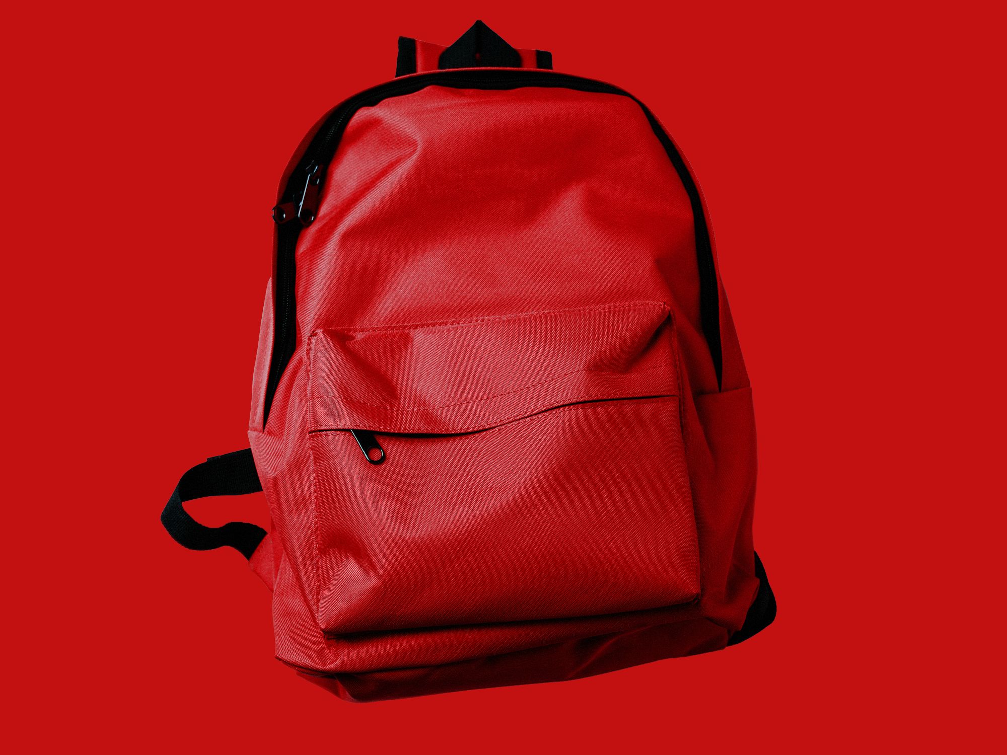 red backpack on red background