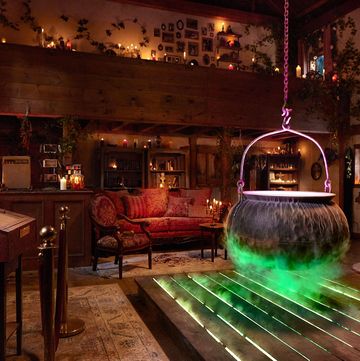 interior of hocus pocus house rental on airbnb with cauldron