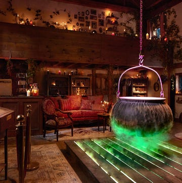 interior of hocus pocus house rental on airbnb with cauldron