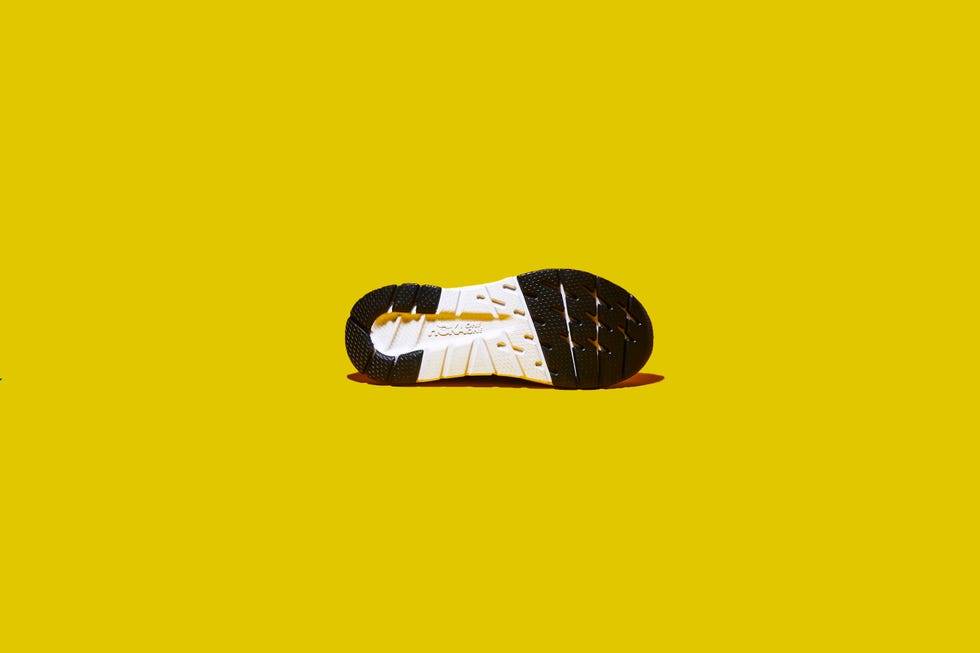 Yellow, Footwear, Shoe, Font, Outdoor shoe, Logo, Athletic shoe, Brand, Sneakers, 