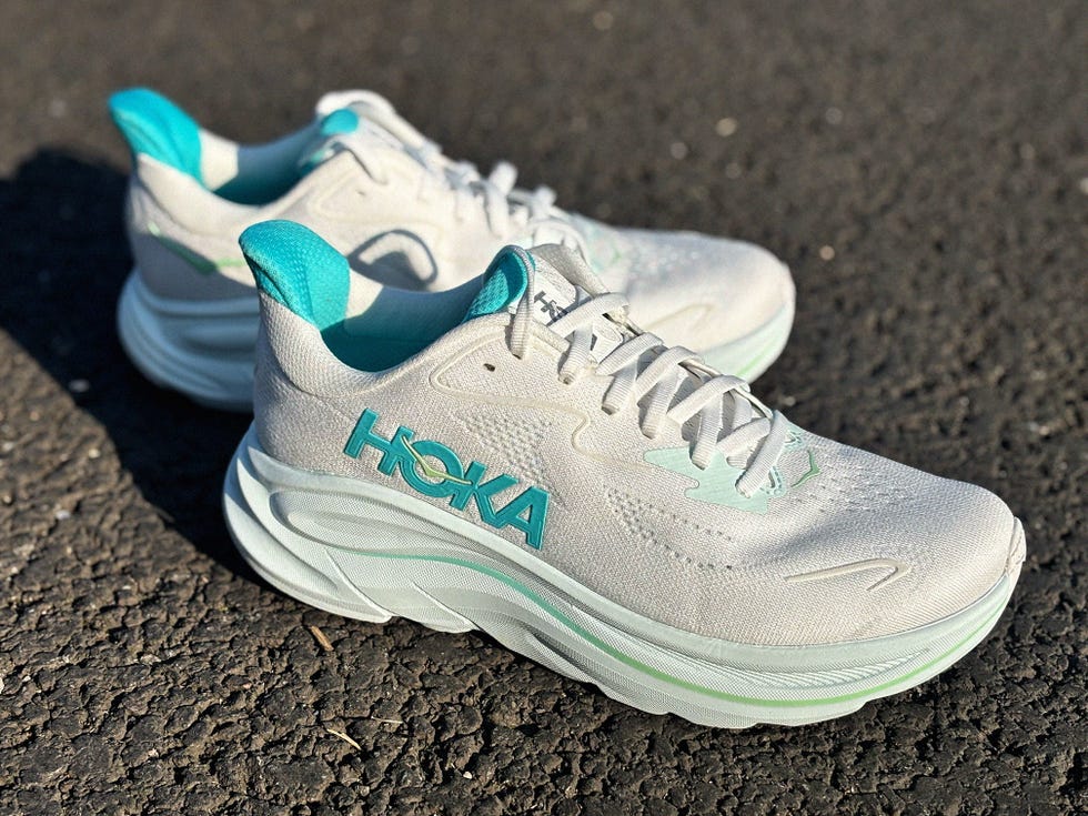 hoka running shoes with a light color scheme and turquoise accents