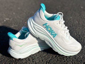 a pair of white and blue running shoes