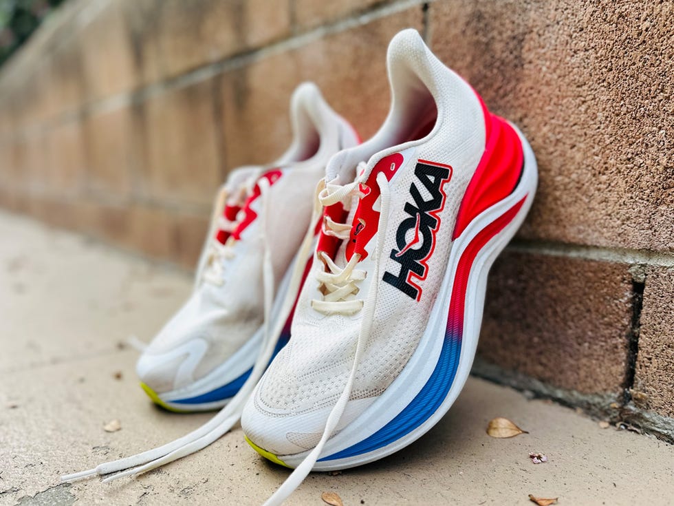 a pair of white and red sneakers