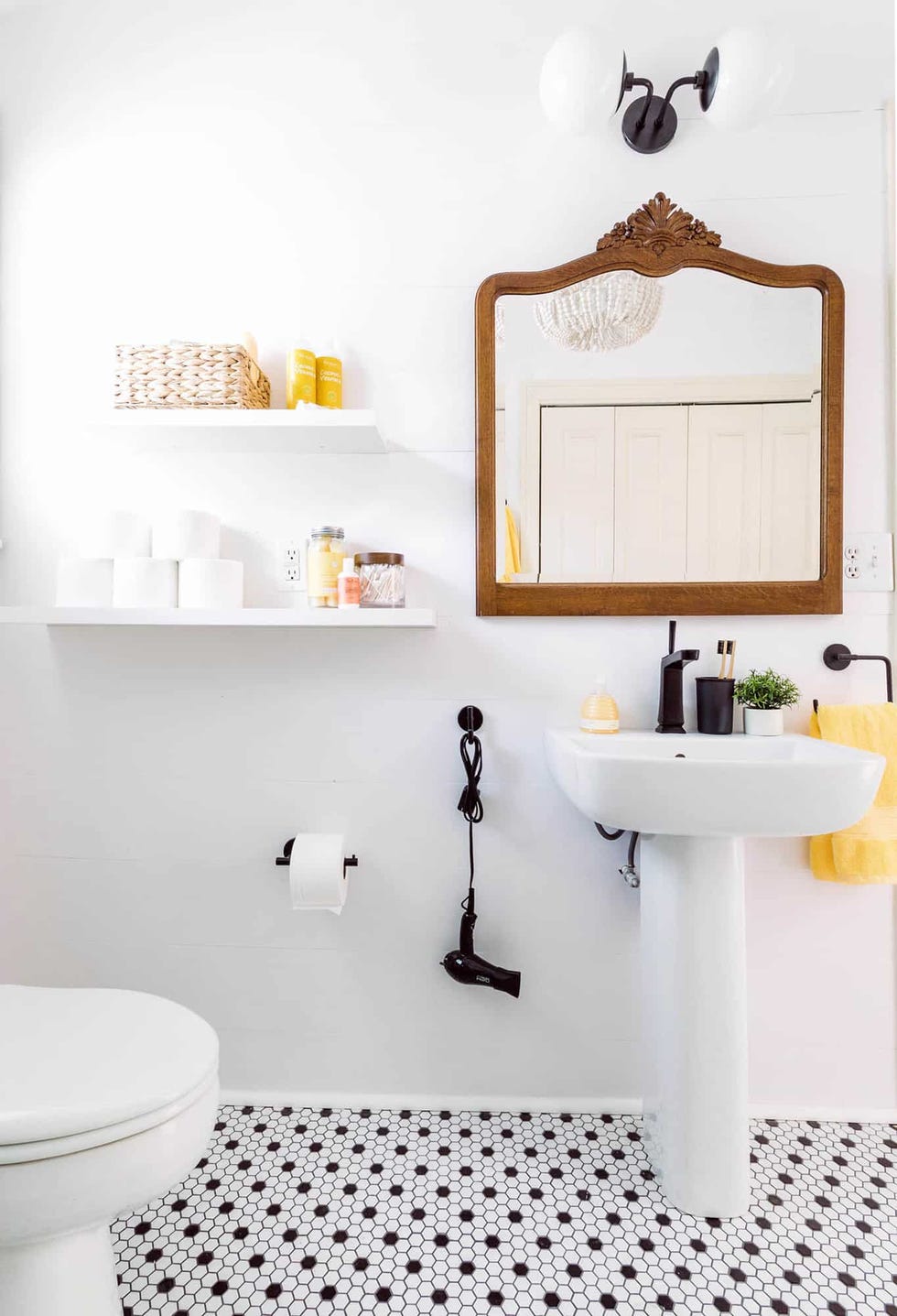 a bathroom with a mirror and sink