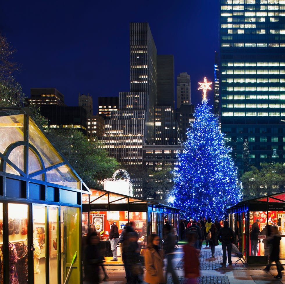 The Holiday Market in Bryant Park. holiday stalls beneath the christmas tree in bryant park