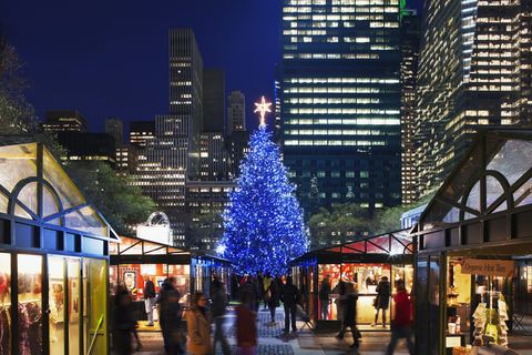 holiday stalls beneath the christmas tree in bryant park