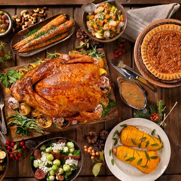 Best Places to Order Thanksgiving Dinner thanksgiving turkey on a table along with side dishes like pecan pie and roasted carrots