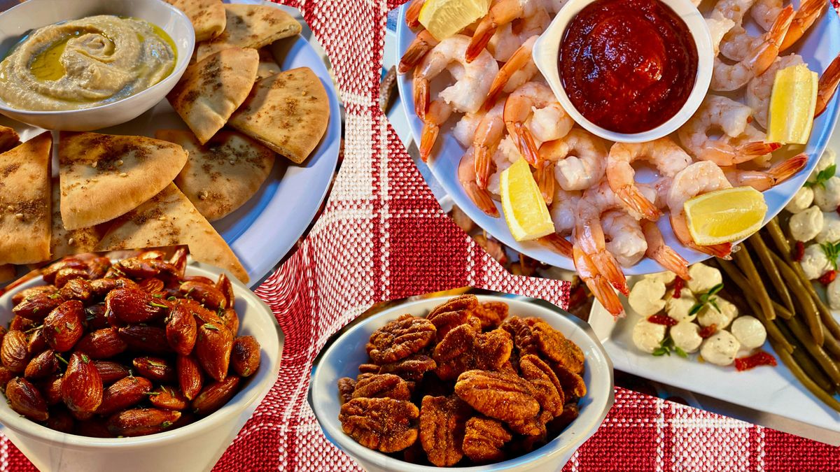 holiday appetizers of warm pita and hummus, shrimp cocktail, and spiced nuts