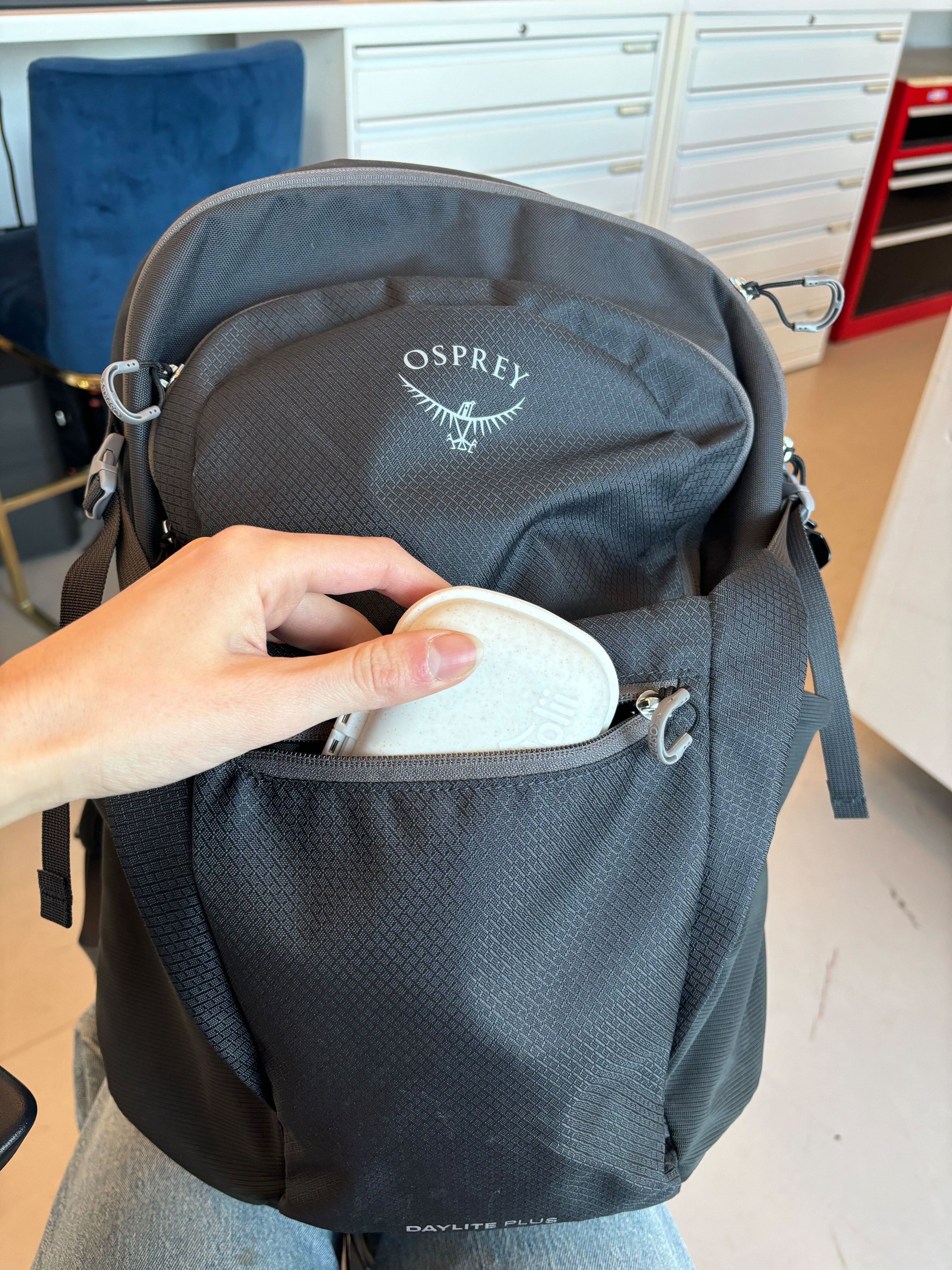 holii travel pill organizer in a backpack pocket