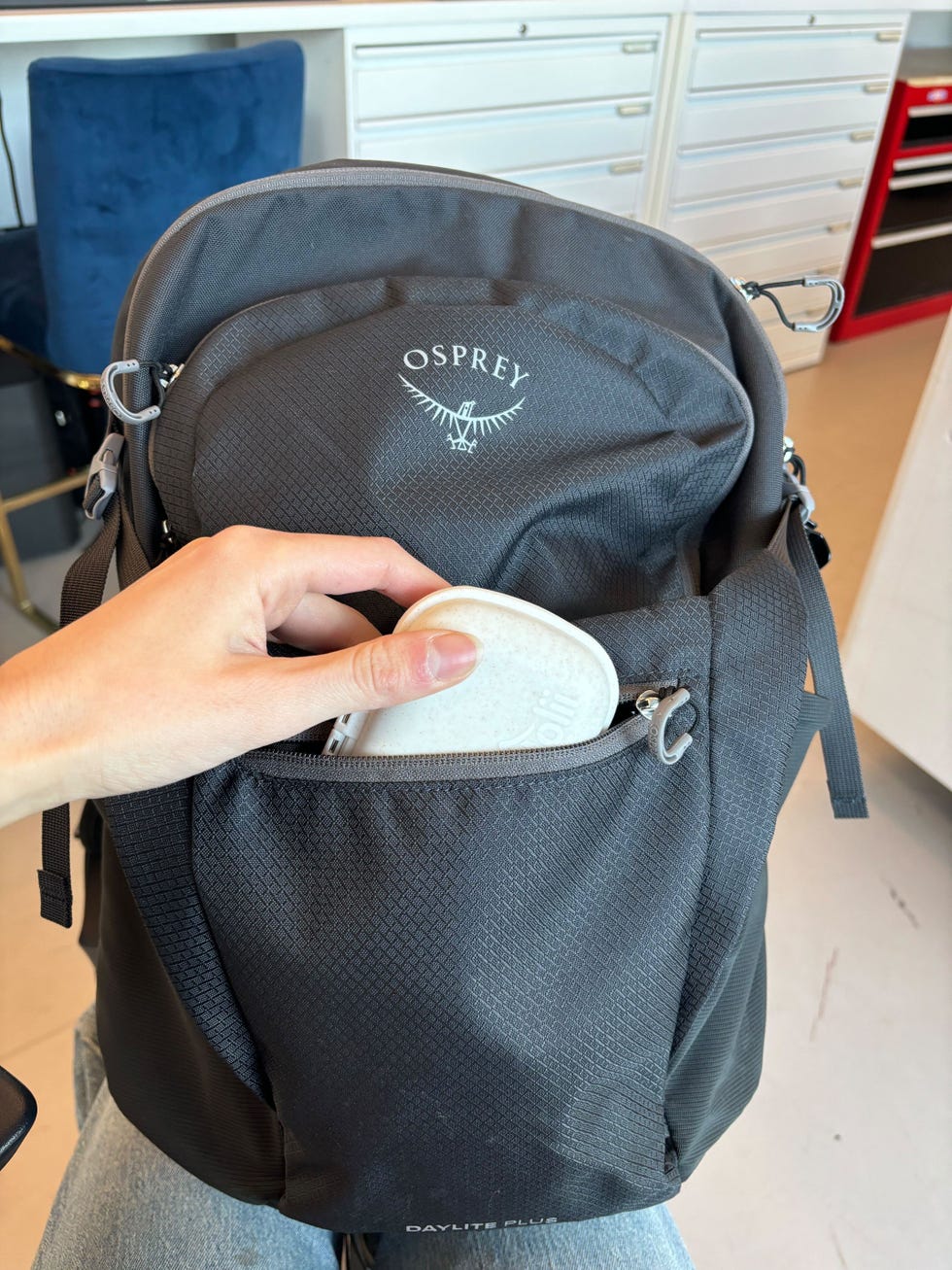holii travel pill organizer in a backpack pocket